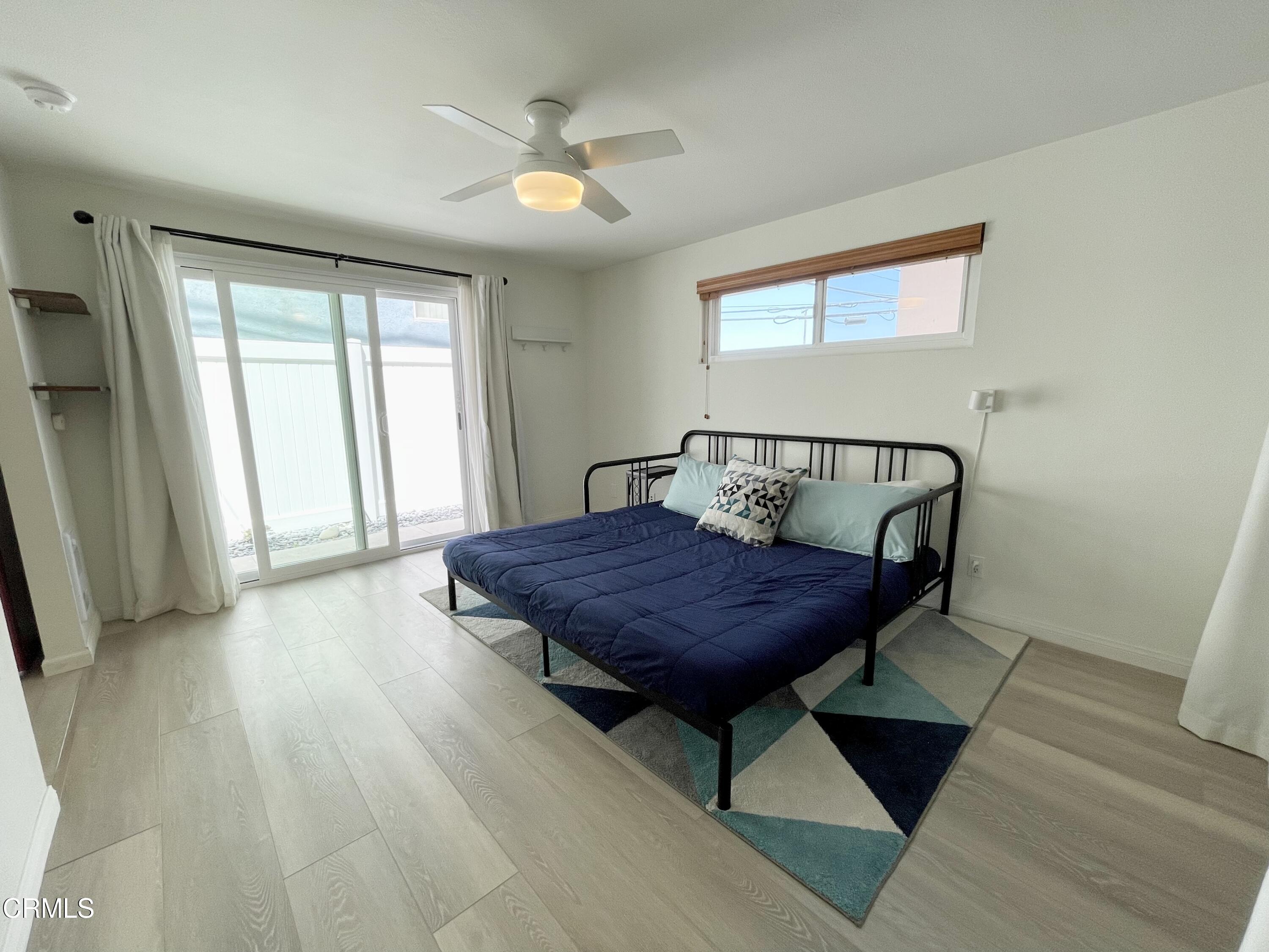 361 Rossmore Drive Oxnard, CA 93035 - Photo 24 of 26 a bedroom with a bed window and a table