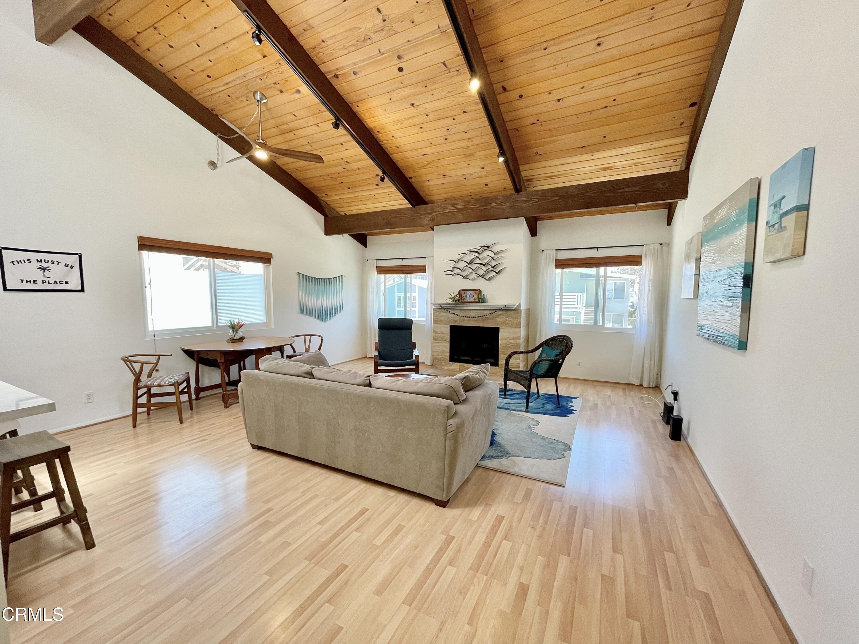 361 Rossmore Drive Oxnard, CA 93035 - Photo 3 of 26 a living room with furniture and a wooden floor