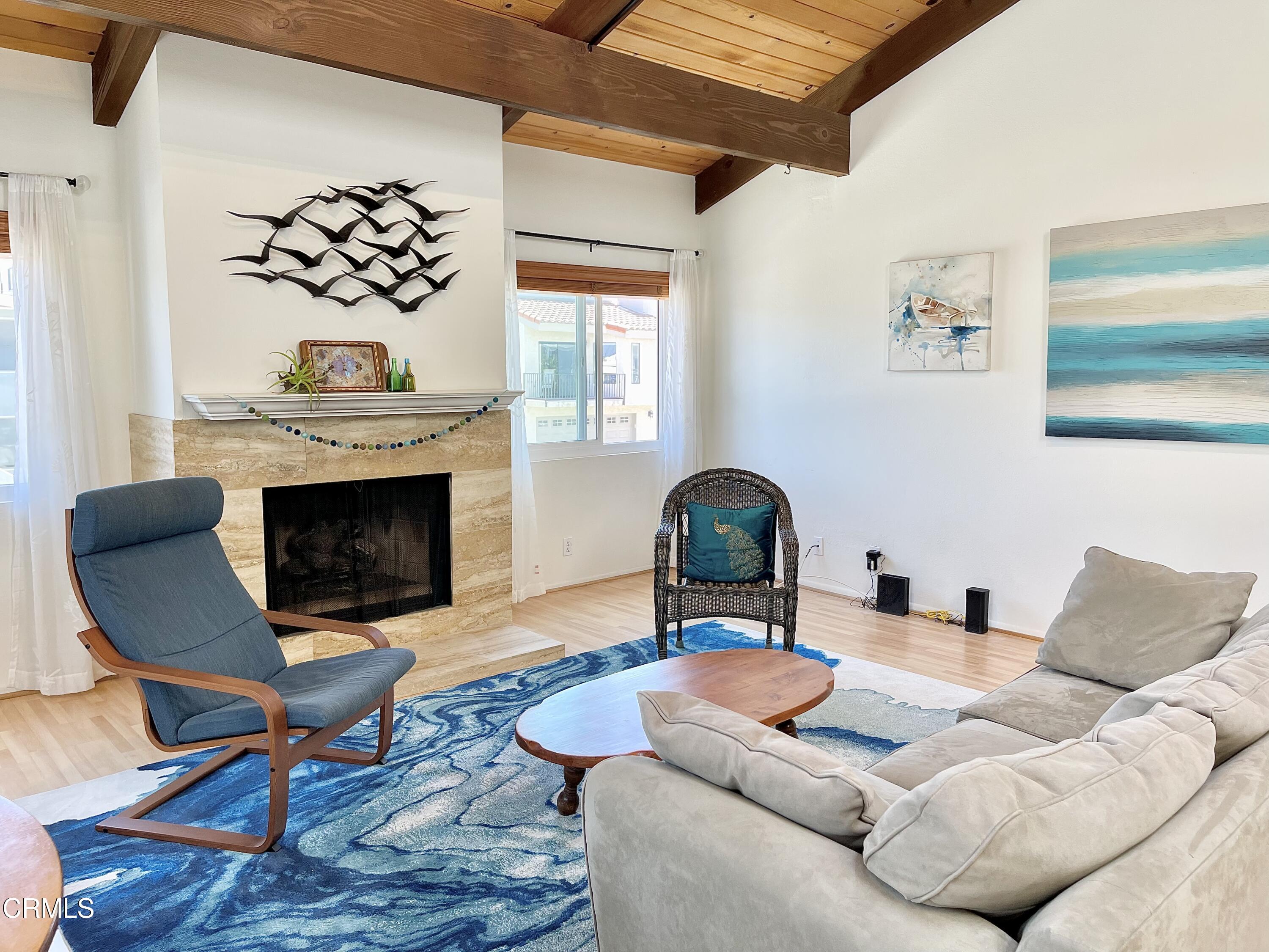 361 Rossmore Drive Oxnard, CA 93035 - Photo 6 of 26 a living room with furniture a fireplace and window