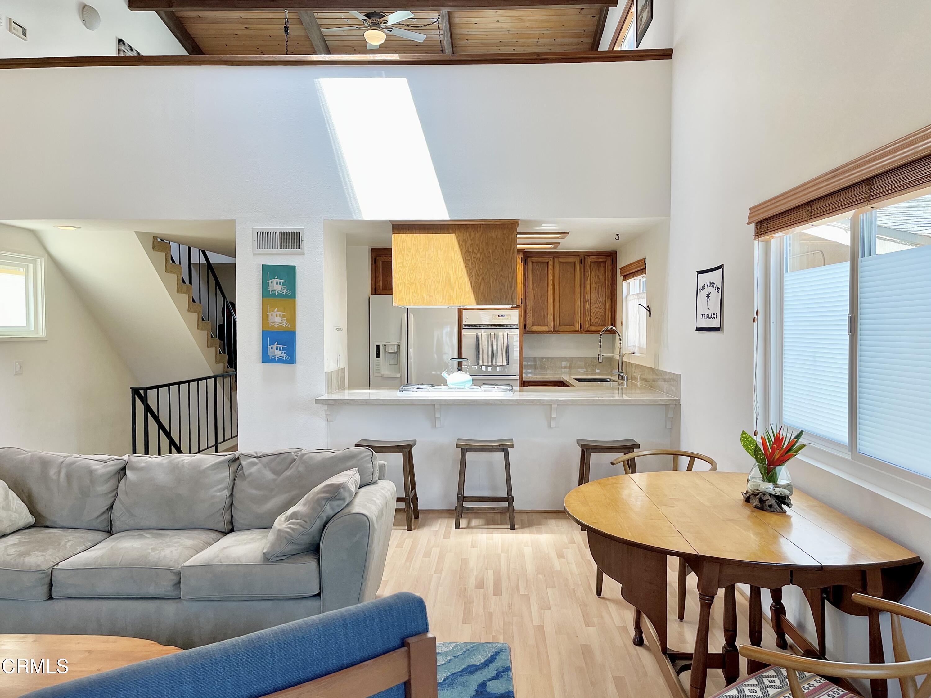 361 Rossmore Drive Oxnard, CA 93035 - Photo 10 of 26 a living room with furniture kitchen view and a wooden floor