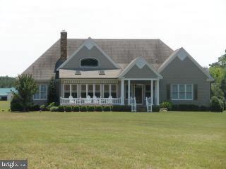 Lot #2 Rivermere Lane Eden, MD 21822 - Photo 2 of 11 a front view of house with yard and trees in the background