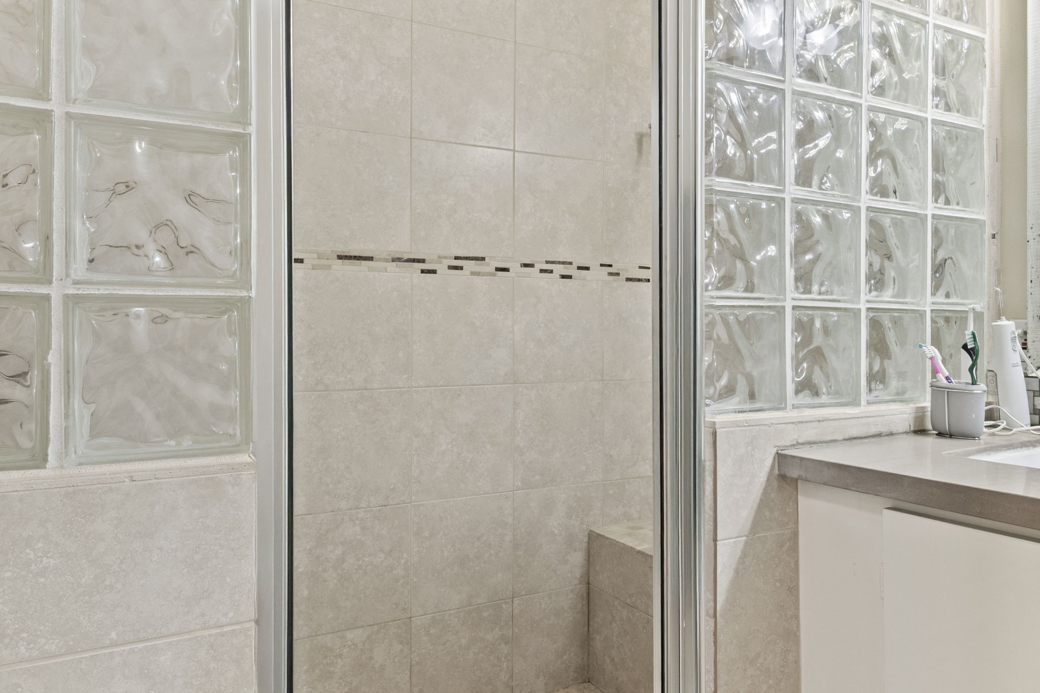 12498 Highway 69 Colmesneil, TX 75938 - Photo 16 of 50 a bathroom with a granite countertop shower and a sink