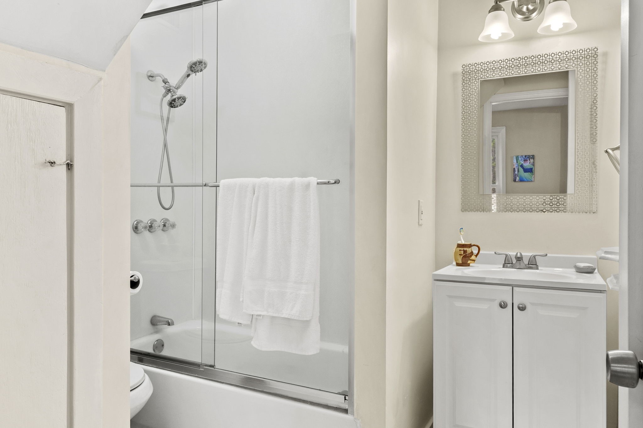 12498 Highway 69 Colmesneil, TX 75938 - Photo 19 of 50 a bathroom with a shower a sink and a mirror