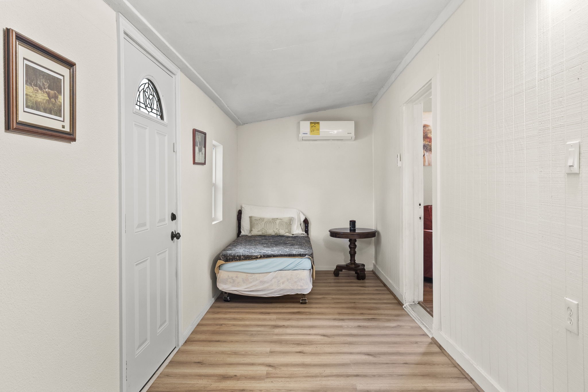 12498 Highway 69 Colmesneil, TX 75938 - Photo 20 of 50 a view of a bedroom with wooden floor and bed