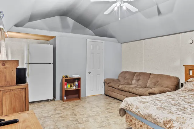 a living room with couches and a fireplace