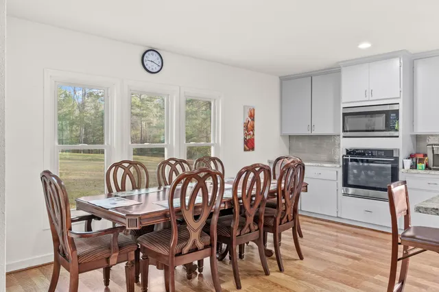 a view of a dining room with furniture window and outside view