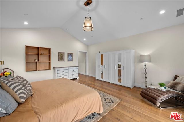 a bathroom with a sink a mirror and a toilet