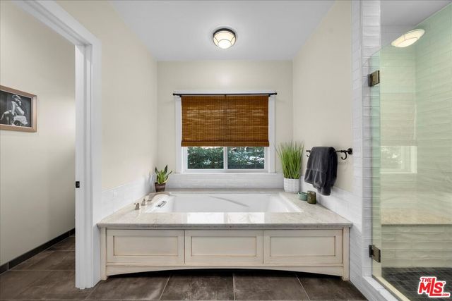 a bedroom with a bed and furniture