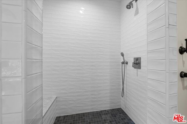 a bedroom with a bed and ceiling fan