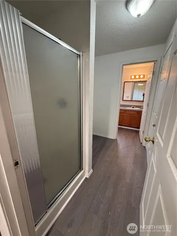 a view of a bathroom from a hallway
