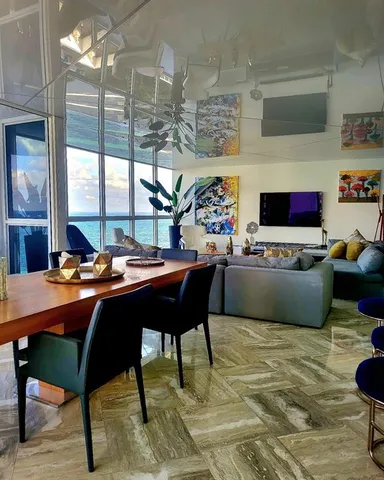 a living room with lots of furniture and a fireplace