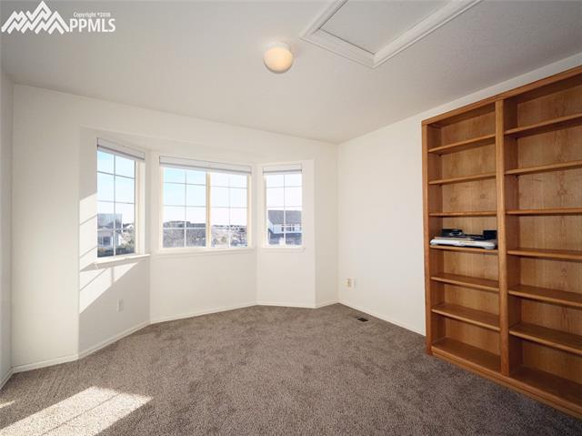 8572 Tibbs Road Peyton, CO 80831 - Photo 12 of 20 2nd of 4 upper level bedrooms.
