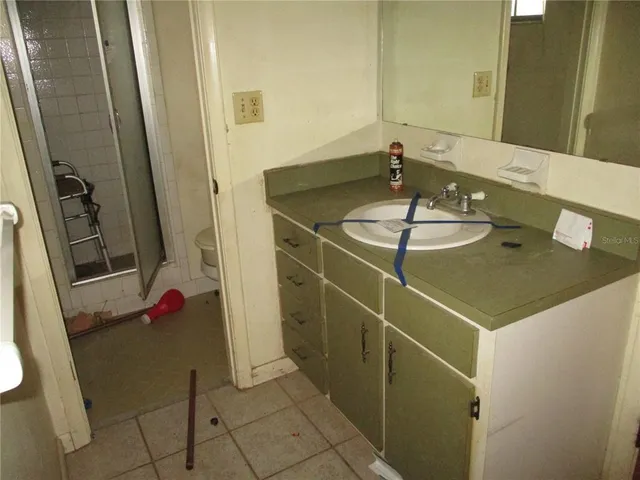 a bathroom with a sink and mirror