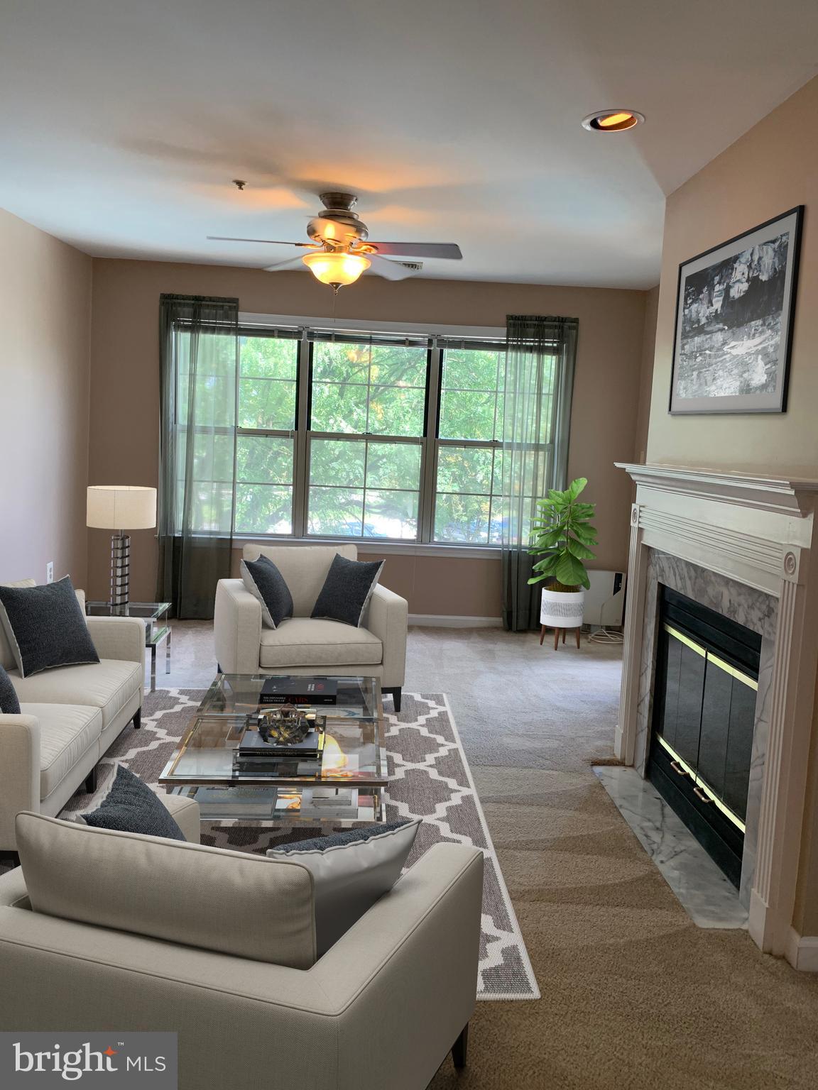 6832 Hayley Ridge Way, Unit G Baltimore, MD 21209 - Photo 1 of 34 Living Rm with private balcony access.