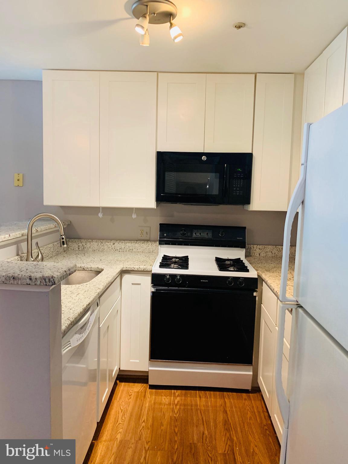 6832 Hayley Ridge Way, Unit G Baltimore, MD 21209 - Photo 11 of 34 Updated kitchen with gas stove.