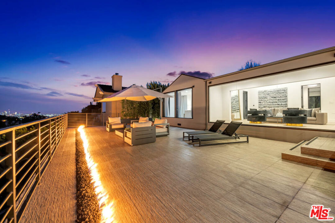 2990 Lakeridge Drive Los Angeles, CA 90068 - Photo 11 of 53 a view of a patio with swimming pool table and chairs