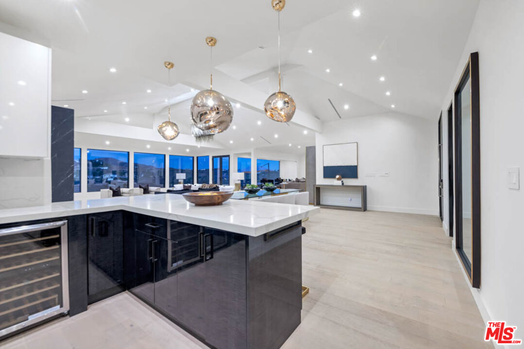 2990 Lakeridge Drive Los Angeles, CA 90068 - Photo 16 of 53 a kitchen with a sink and a stove top oven with wooden floor