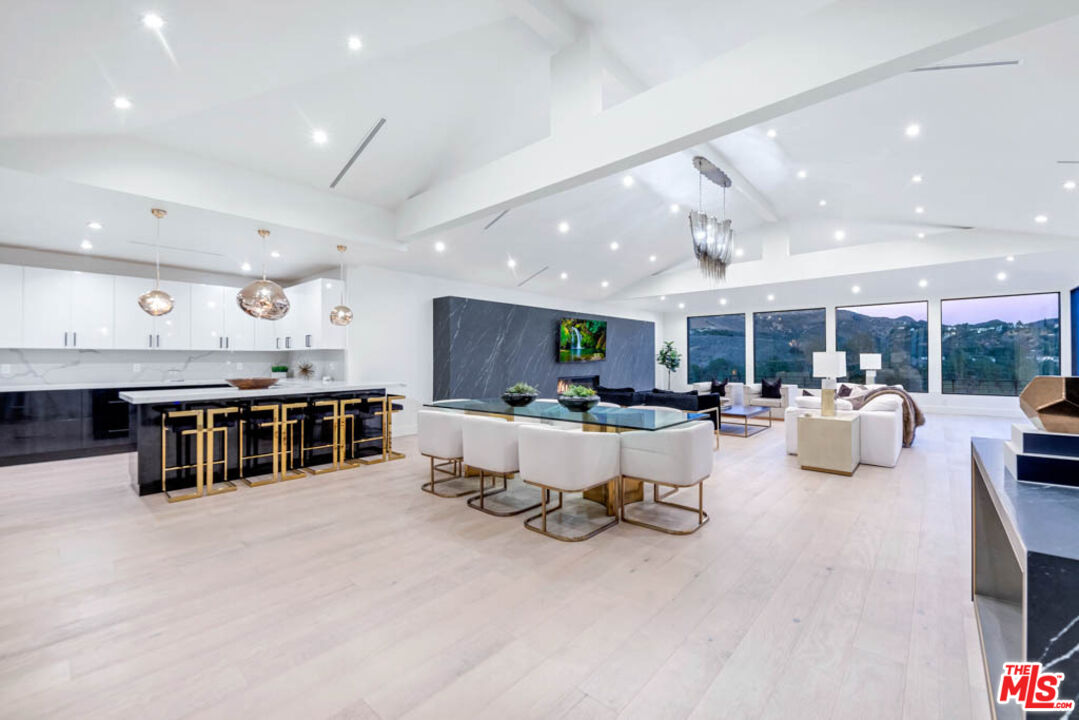 2990 Lakeridge Drive Los Angeles, CA 90068 - Photo 2 of 53 a living room with furniture and a flat screen tv