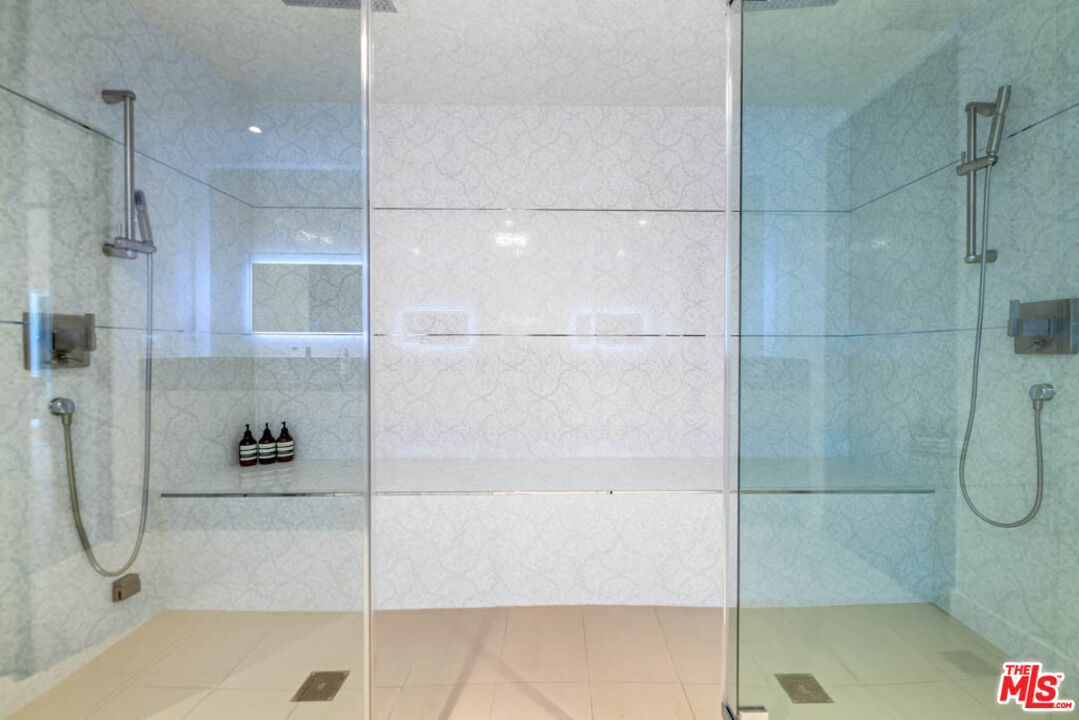 2990 Lakeridge Drive Los Angeles, CA 90068 - Photo 25 of 53 a bathroom with a glass shower door