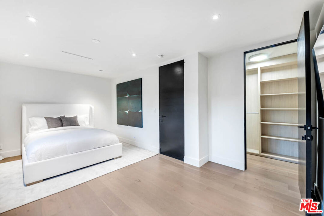 2990 Lakeridge Drive Los Angeles, CA 90068 - Photo 29 of 53 a bedroom with a bed and a walk in closet