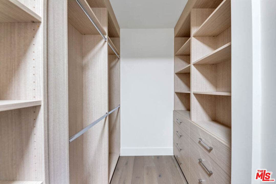 2990 Lakeridge Drive Los Angeles, CA 90068 - Photo 31 of 53 a view of walk in closet with empty racks