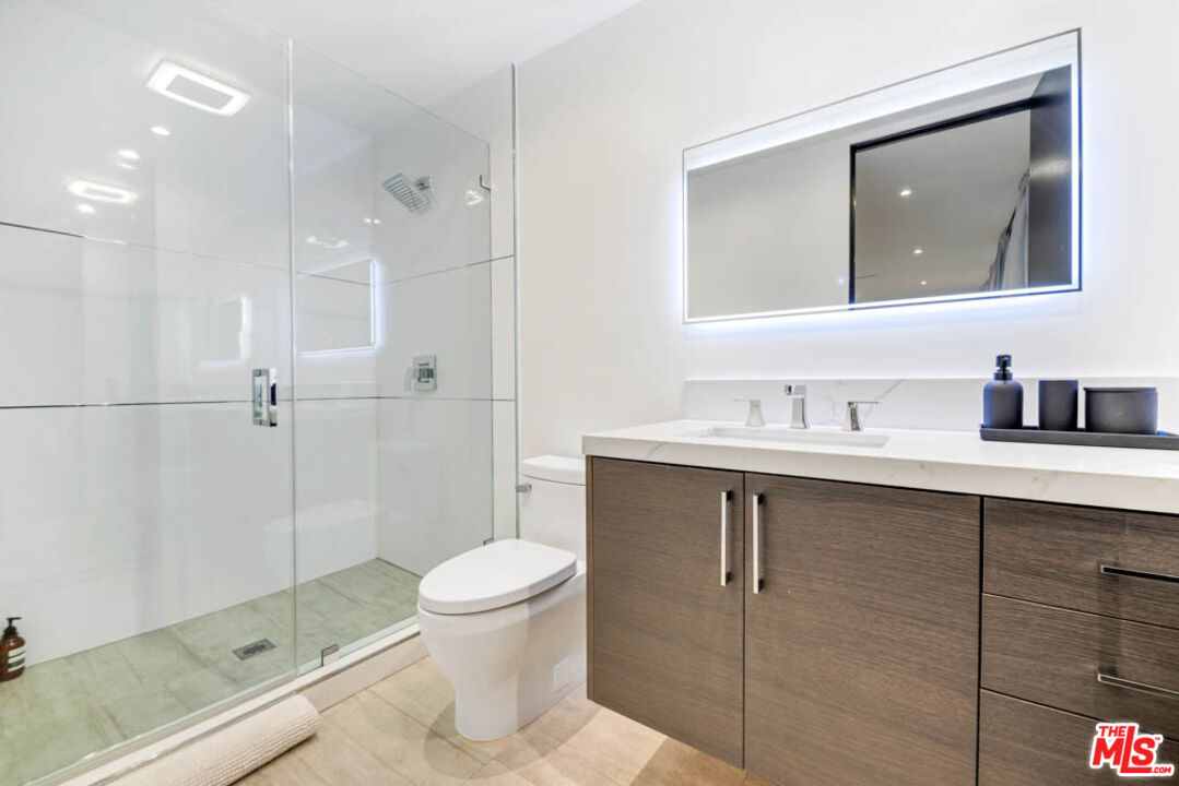 2990 Lakeridge Drive Los Angeles, CA 90068 - Photo 34 of 53 a bathroom with a sink a toilet and shower