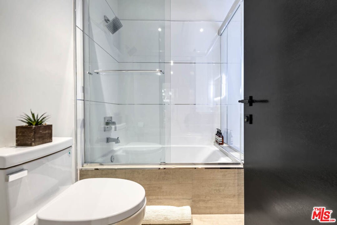 2990 Lakeridge Drive Los Angeles, CA 90068 - Photo 41 of 53 a bathroom with a sink a toilet and shower