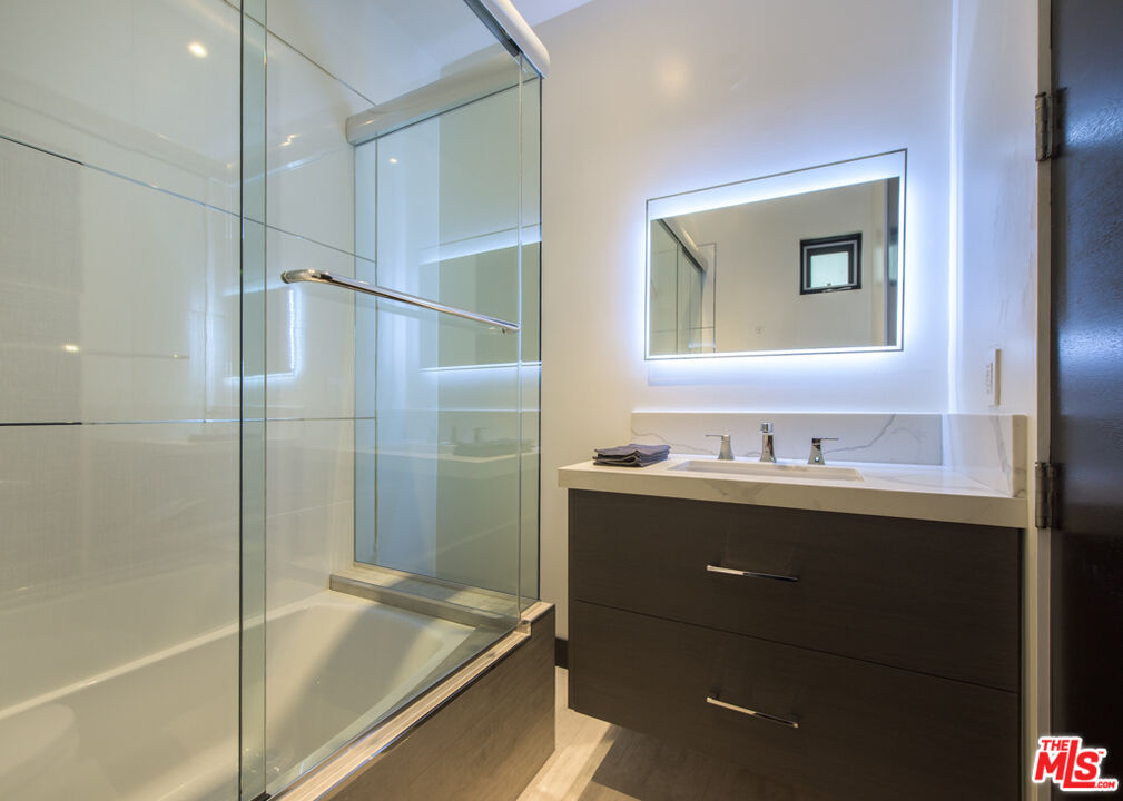 2990 Lakeridge Drive Los Angeles, CA 90068 - Photo 42 of 53 a bathroom with a granite countertop sink mirror and double