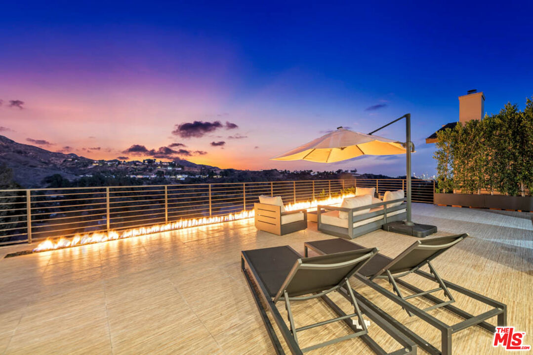 2990 Lakeridge Drive Los Angeles, CA 90068 - Photo 5 of 53 a view of a swimming pool with seating space