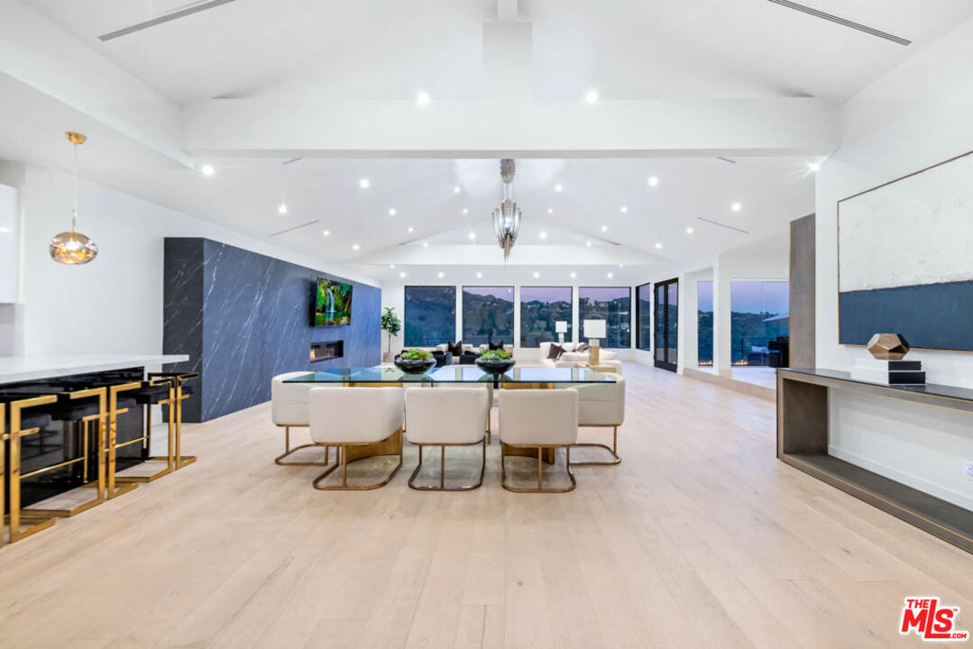 2990 Lakeridge Drive Los Angeles, CA 90068 - Photo 7 of 53 a view of a dining hall with furniture and a flat screen tv