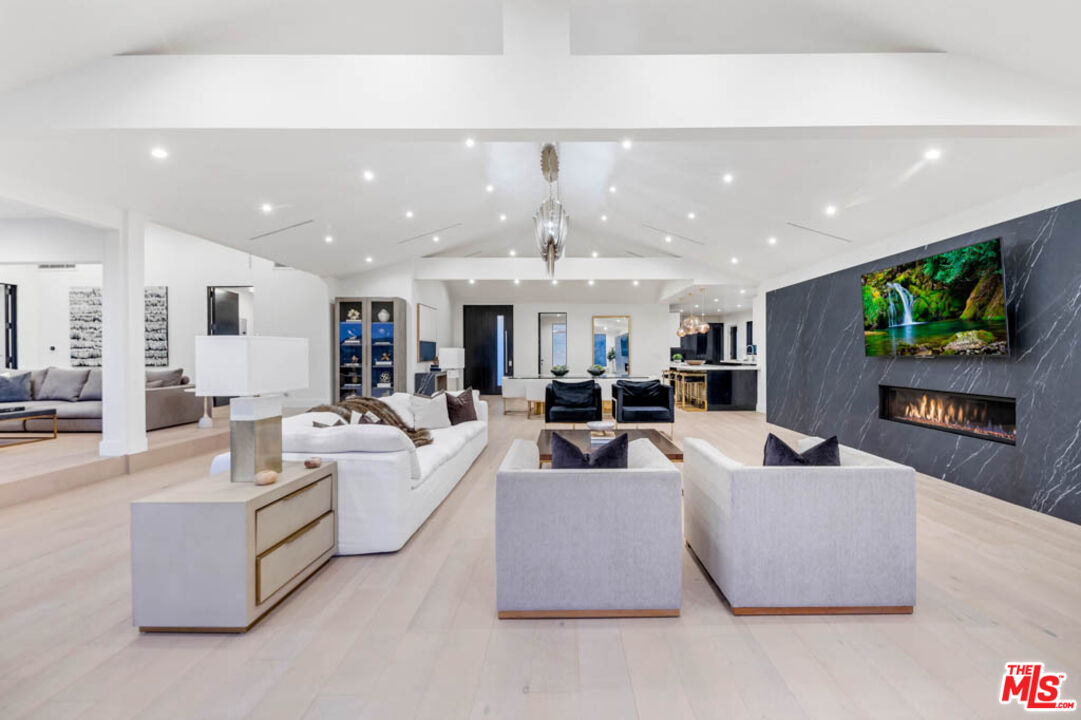 2990 Lakeridge Drive Los Angeles, CA 90068 - Photo 8 of 53 a living room with fireplace furniture and a flat screen tv