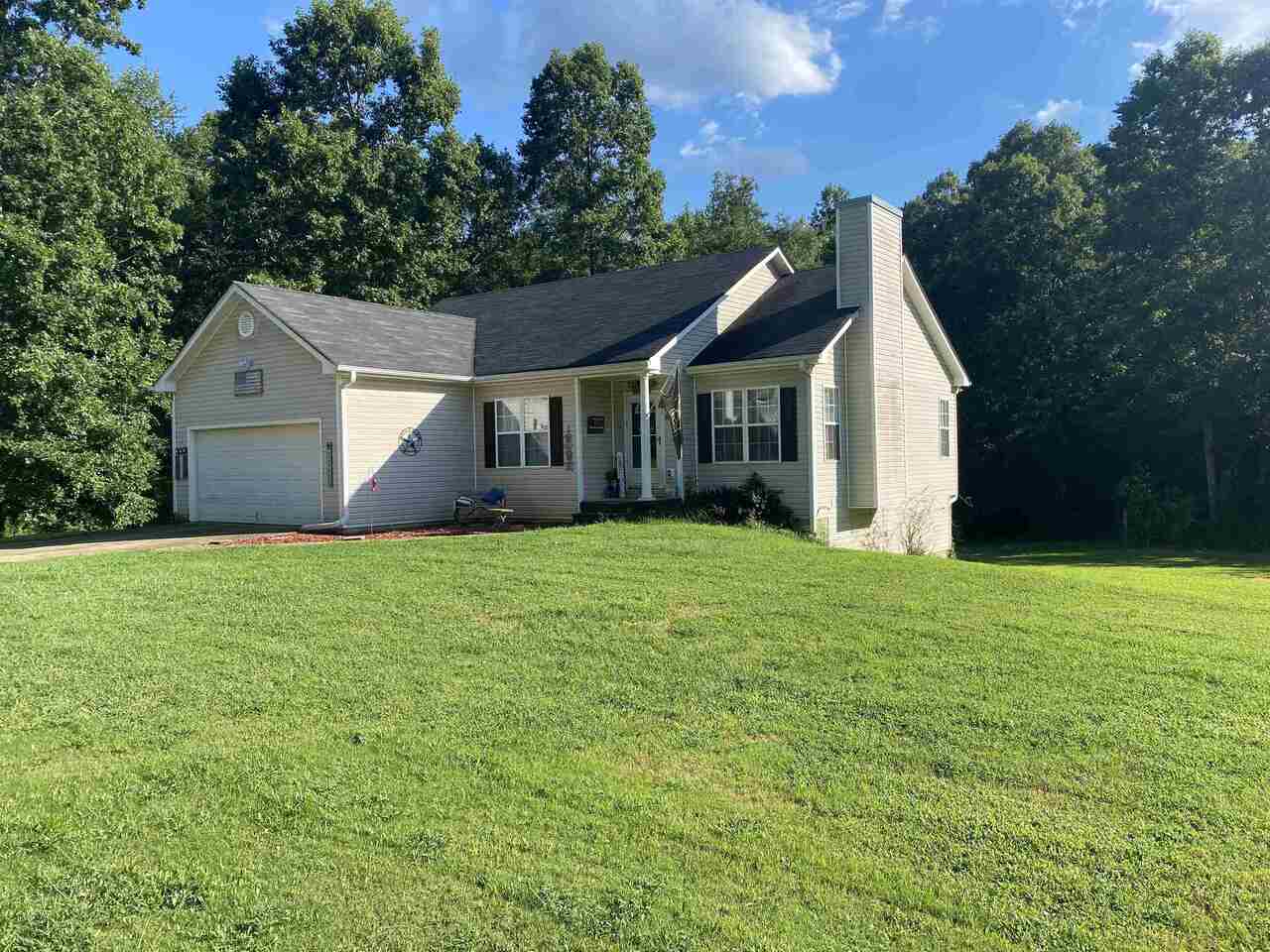 130 Mountain Ridge Covington, GA 30016 - Photo 1 of 1 a front view of house with yard and green space