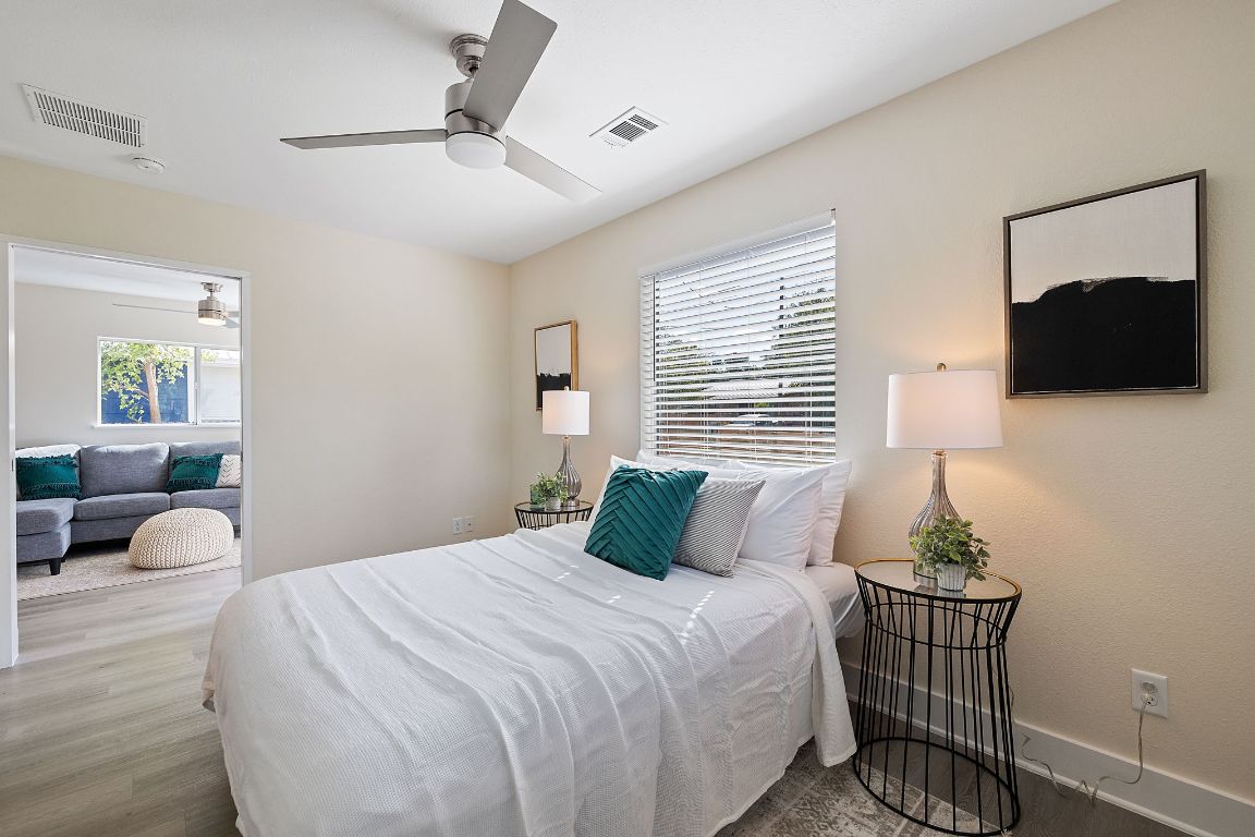 1171 Nickols Avenue, Unit 1 Austin, TX 78721 - Photo 14 of 22 Bedroom featuring a ceiling fan and wood finished floors
