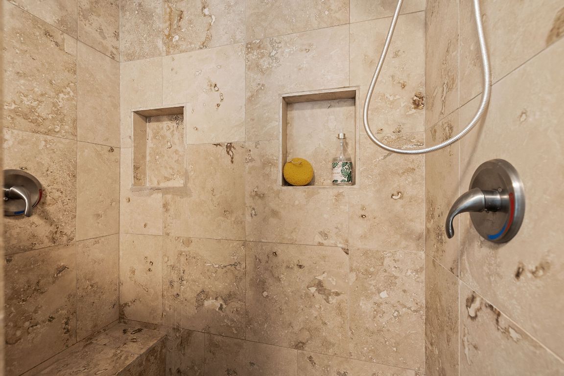 1171 Nickols Avenue, Unit 1 Austin, TX 78721 - Photo 17 of 22 Bathroom view of a tile shower