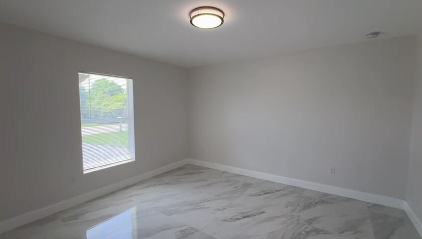 6465 Alexander Road West Palm Beach, FL 33413 - Photo 15 of 20 an empty room with a window