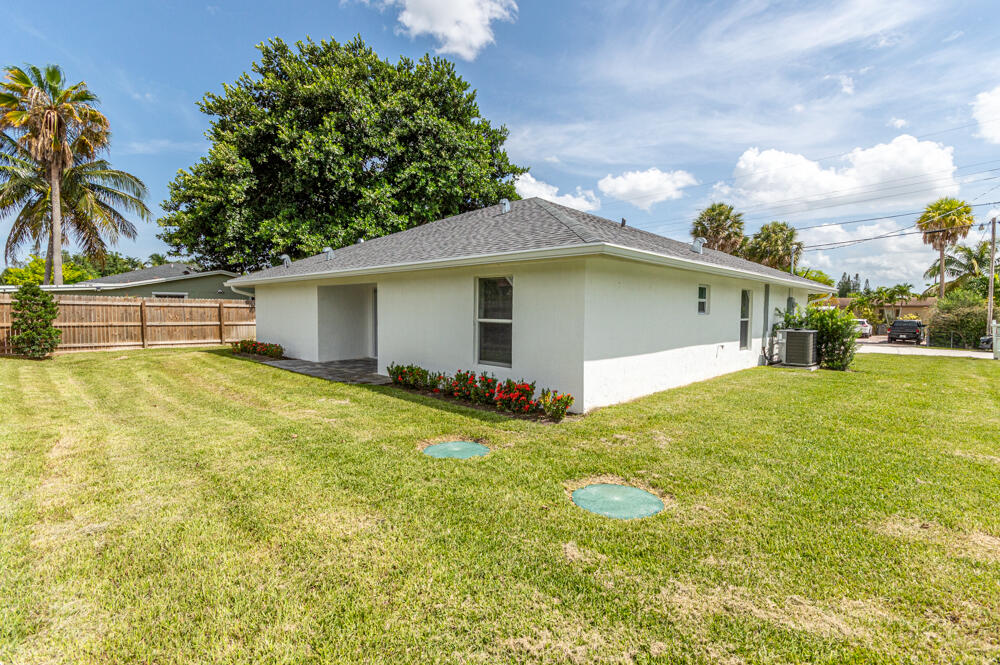 6465 Alexander Road West Palm Beach, FL 33413 - Photo 20 of 20 a house view with swimming pool in front of it