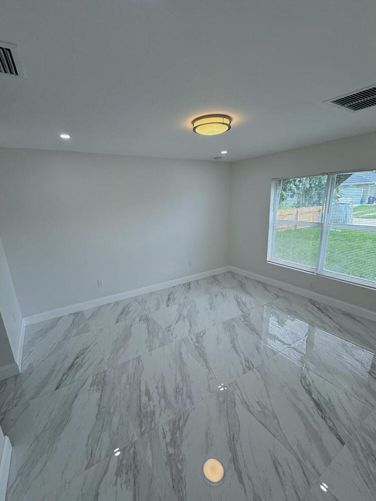 6465 Alexander Road West Palm Beach, FL 33413 - Photo 10 of 20 a view of a storage & utility room with window