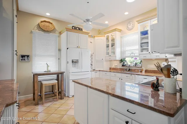 a kitchen with a sink stainless steel appliances and cabinets