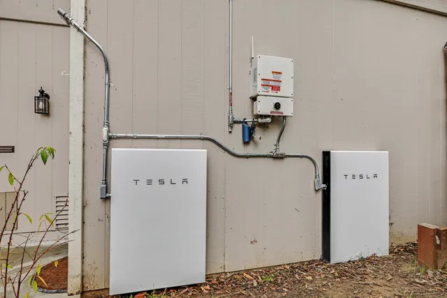 a view of a bedroom with bed and wooden floor