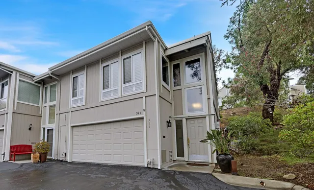 a front view of a house with a garage