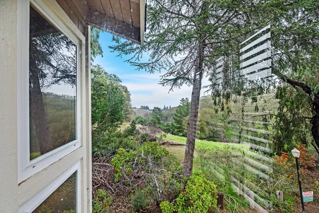 a view of a garden from a balcony
