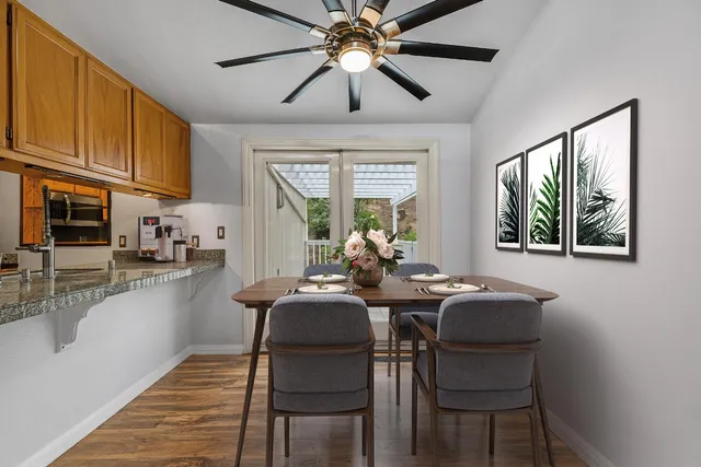 a view of a dining room with furniture window and outside view