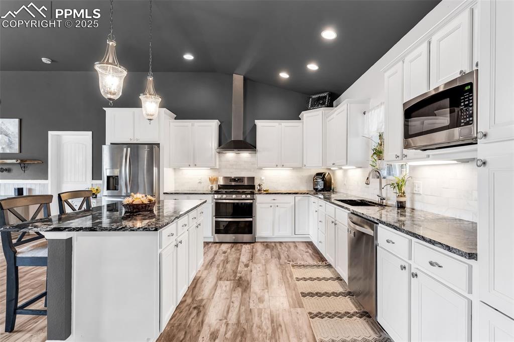 10380 Coyote Lane Rye, CO 81069 - Photo 11 of 50 a kitchen with stainless steel appliances granite countertop a sink and stove top oven