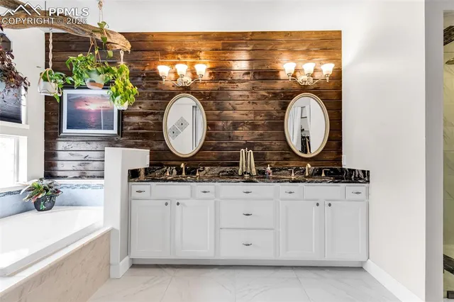 a bathroom with a sink a vanity and a mirror