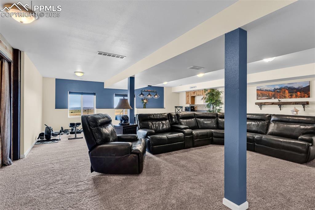 10380 Coyote Lane Rye, CO 81069 - Photo 22 of 50 a living room with furniture and a large window