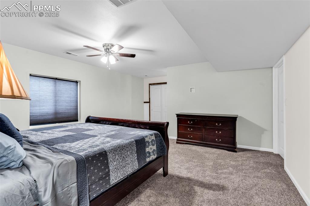 10380 Coyote Lane Rye, CO 81069 - Photo 26 of 50 a bedroom with a bed and a dresser