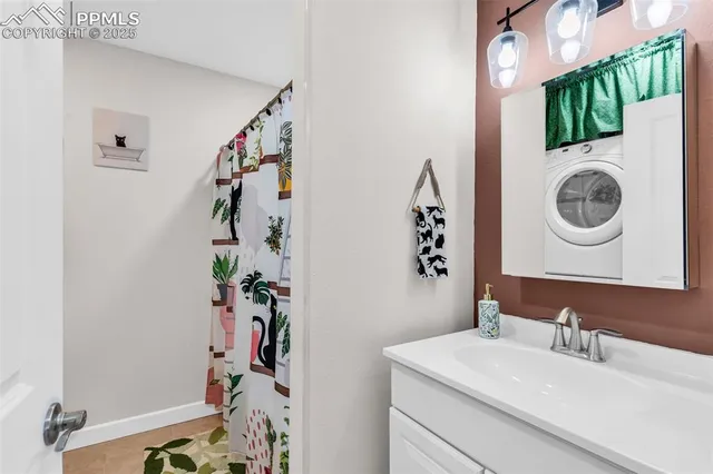 a bathroom with a sink vanity and mirror