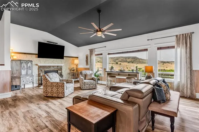 a living room with furniture fireplace and a flat screen tv