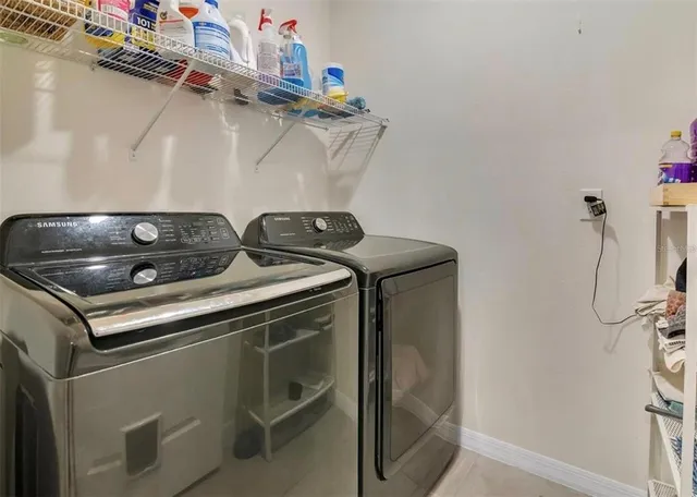 a utility room with dryer and washer
