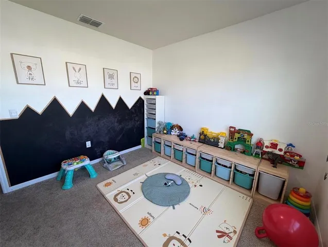 a bedroom with furniture and a bed